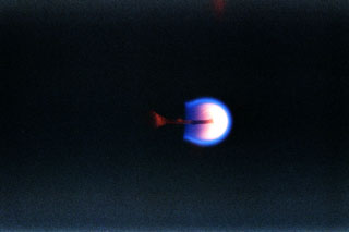 Candle flames in microgravity experiment